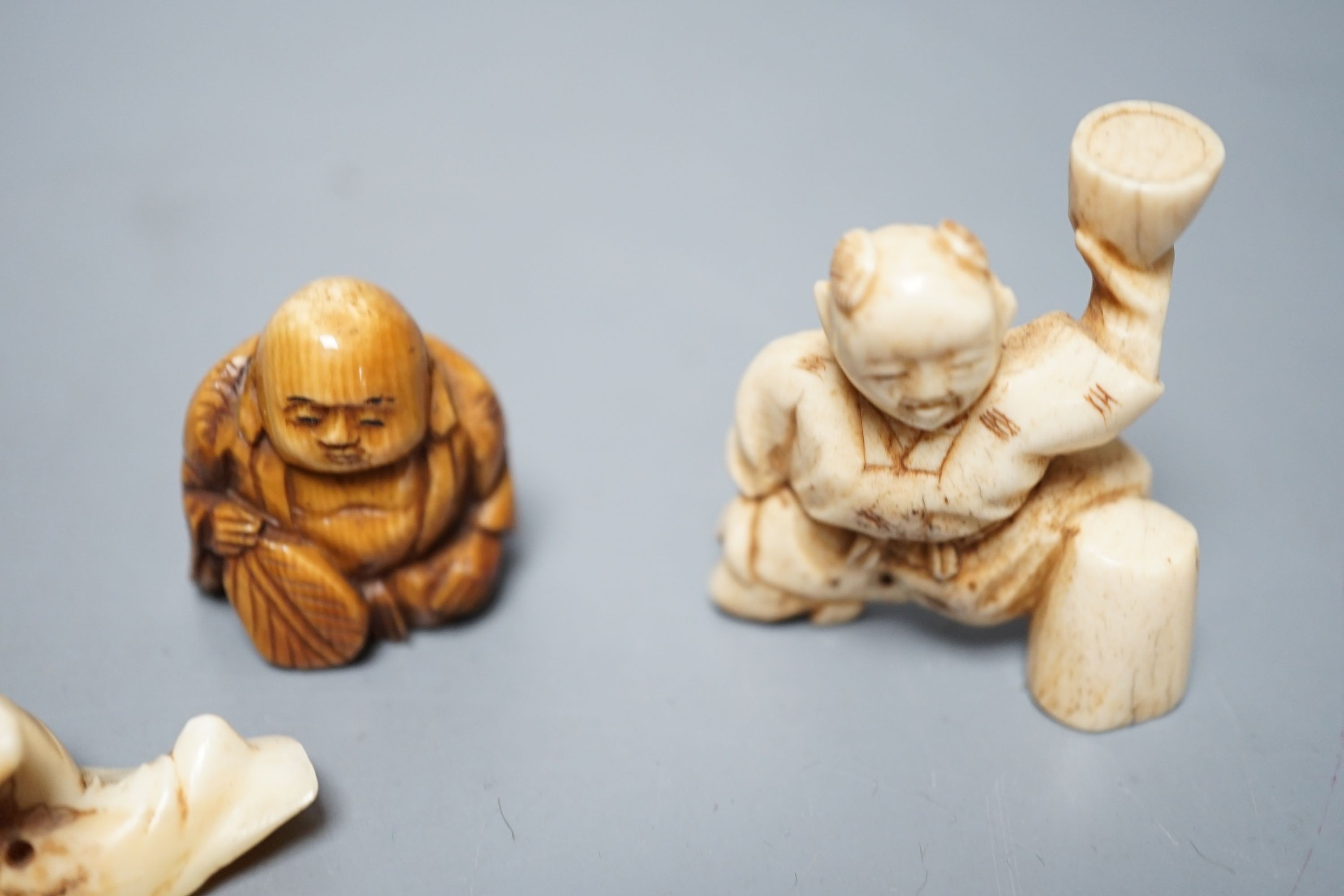 A collection of eight Japanese Ivory and bone Netsuke and okimono, 19th/early 20th century